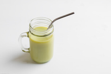 Matcha green tea latte in glass jar