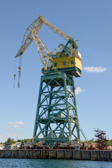 Fototapeta na wymiar Powerful crane is in Southern Bay seaport, Sevastopol, Crimea, Russia.