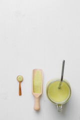 Matcha latte with coconut milk in jar glass