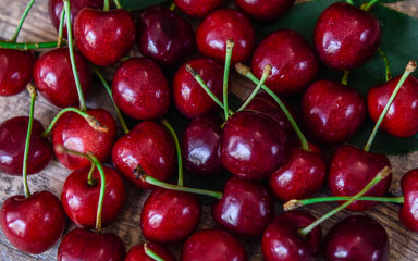 Background of red ripe cherries. Sweet ripe berry. View from above. Close-up