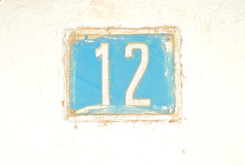Numebr 12, twelve, blue on white background..