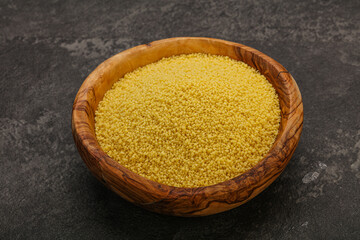 Raw cous cous heap in the bowl