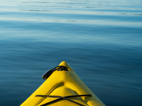 bow of yellow kayak on water