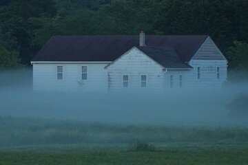 Old building in the distance with fog in Graytown, Dunn County Wisconsin
