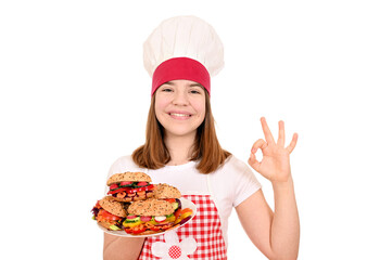 Female cook with vegan sandwiches and ok hand sign