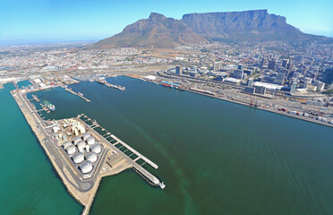 Cape Town, Western Cape / South Africa - 03/19/2018: Aerial photo of fuel storage at Cape Town Harbour with Table Mountain in the background