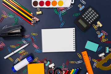 notebook with a pen on a blue background