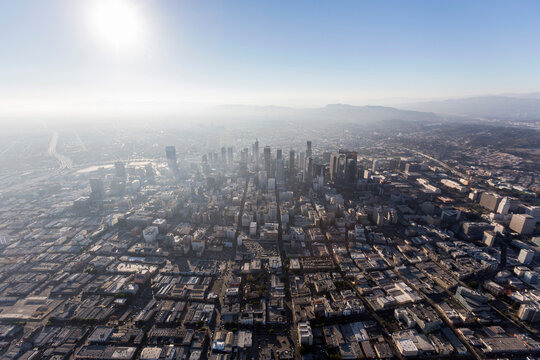 Aerial view of sunshine and smog above urban downtown Los Angeles in Southern California.