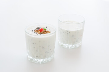 Two glasses with chia pudding. Milk dessert with chia seeds.