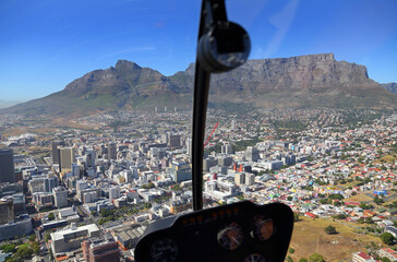 Cape Town, Western Cape / South Africa - 02/27/2014: Aerial photo a pilots view from a helicopter of Table Mountain and Cape Town CBD