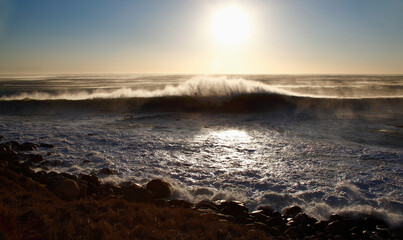 Cape Town, Western Cape / South Africa - 04/15/2011: Waves crash on a beach at sunset