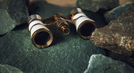 binoculars on the stones