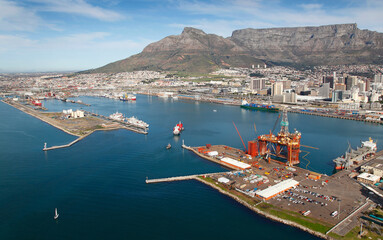 Cape Town, Western Cape / South Africa - 07/19/2012: Aerial photo of oil rig in Table Bay Harbour with Table Mountain in the background