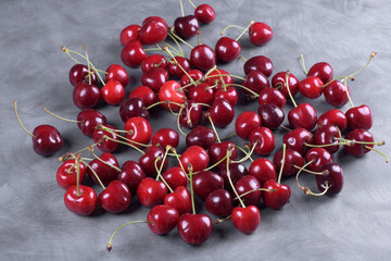 Red Cherries. pile of ripe cherries with stalks.