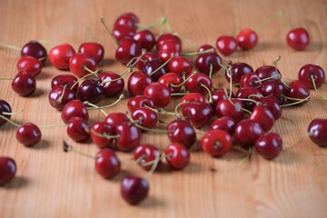 Red Cherries. pile of ripe cherries with stalks.