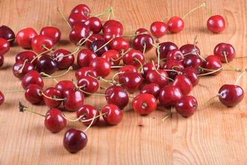 Red Cherries. pile of ripe cherries with stalks.