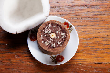 Nutrition concept -Healthy small sweet quiche pie over wooden background. Healthy food, Diet, Detox, Clean Eating or Vegetarian concept. Homemade delicious baked muffin with chocolate and coconut.