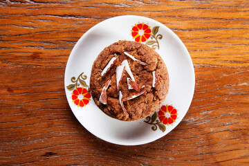 Nutrition concept -Healthy small sweet quiche pie over wooden background. Healthy food, Diet, Detox, Clean Eating or Vegetarian concept. Homemade delicious baked muffin with chocolate and coconut.