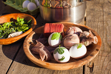 Close up eggs with green plants on them. Preaparation for colouring