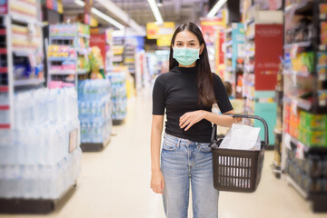 woman with face mask is shopping clothes in Shopping center