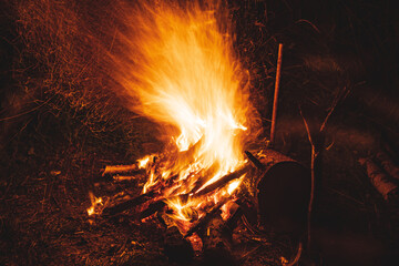 Bonfire at night. Bonfire burning at night, sparks, flames of the fire.