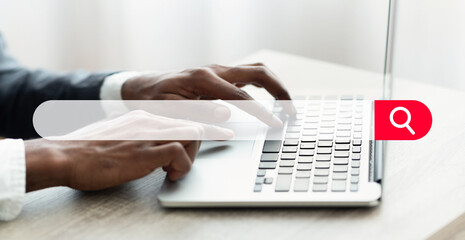 Searching Online. Search Bar Tool With Businessman Working On Laptop On Background