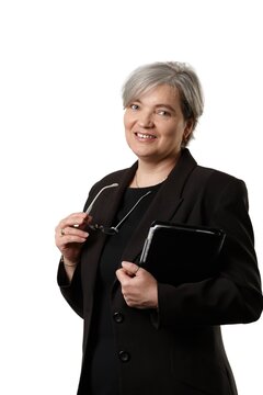 Mature businesswoman looking at camera, isolated on white background. 