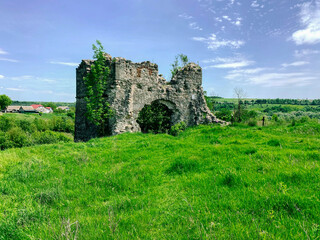 Fototapeta na wymiar Old ruined abandoned castle on the hill, ruins photo, Ukraine, Sutkivci.
