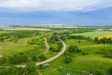 Highway between agriculture fields. Aerial view.