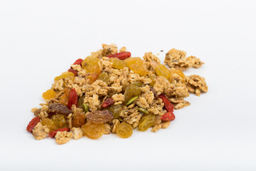 Top View Close up Mixture of granola or muesli on white background, dehydrated fruit mix, healthy food, almond, sun dried cultivated banana, cranberry, cashew nut, pumpkin, melon seed