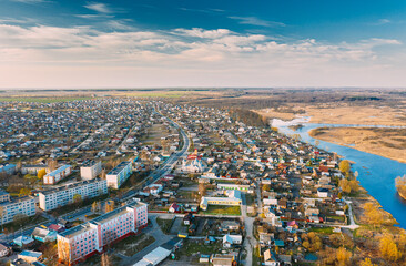 Obraz premium Dobrush, Gomel Region, Belarus. Aerial View Of Dobrush Cityscape Skyline In Spring Evening. Residential District And River In Bird's-eye View