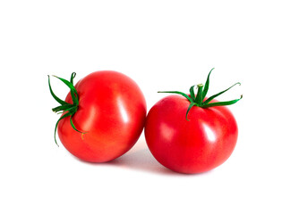 Two ripe bright red tomatoes with green tails on white background