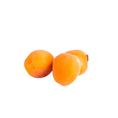 Few whole ripe orange apricots on white background