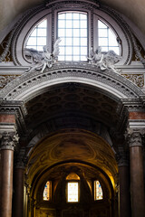 Monumental arch under the dome of a church in Rome