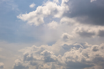 Blue sky background with big white tiny stratus cirrus striped clouds