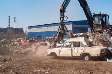 Utilization of the car. Old car at the dump of scrap metal. Utilization of the car at the dump.