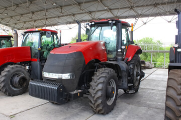 Obraz premium The colorful tractors in the road