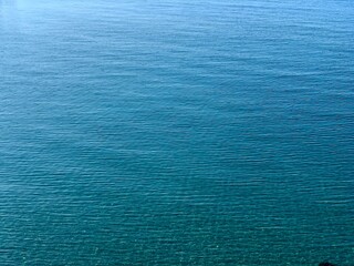 Fototapeta na wymiar Azure blue surface of summer Mediterranian sea