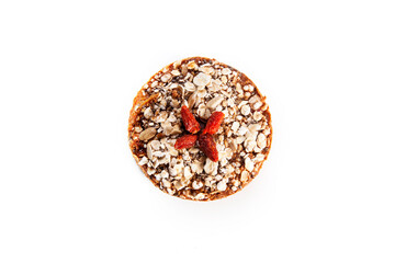 Fruit cake over white background. Traditional homemade Christmas cake with goji berries and...