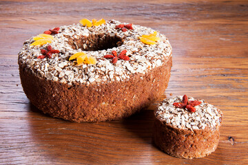 Traditional homemade Christmas cake. Holiday dessert with Damascus and dry goji berry on vintage...