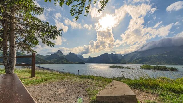 Timelapse of the passage of the clouds from the well-known most beautiful bench of Leon in the Ria&ntilde;o reservoir, Leon, Spain