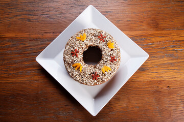Traditional homemade Christmas cake. Holiday dessert with Damascus and dry goji berry on vintage...