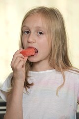 little girl eating watermelon