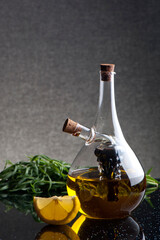 A glass cruet with olive oil and balsamic vinegar