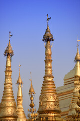 Fototapeta premium detail view to a group of golden stupas at the Shwedagon Pagoda in Yangoon, Myanmar (Burma)