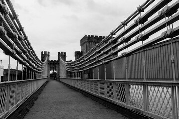 Old suspension bridge in the town of Conwy in Wales