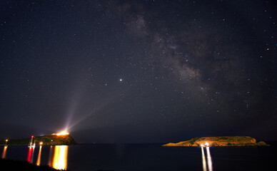 Fototapeta na wymiar Milky Way getting lighted from Poseidon's temple in Sounio, Greece