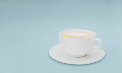 Cappuccino Template for posters and banners with copy space White cup of creamy coffee on a light-blue background
