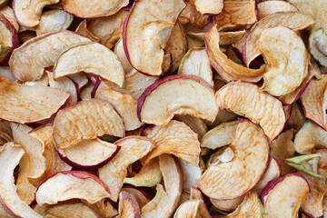 homemade dried apple slices close up as food background