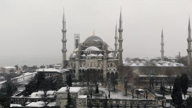 Aerial footage of Blue Mosque in winter time. Sultanahmet, Istanbul. Popular tourist destination. Сultural heritage 4K